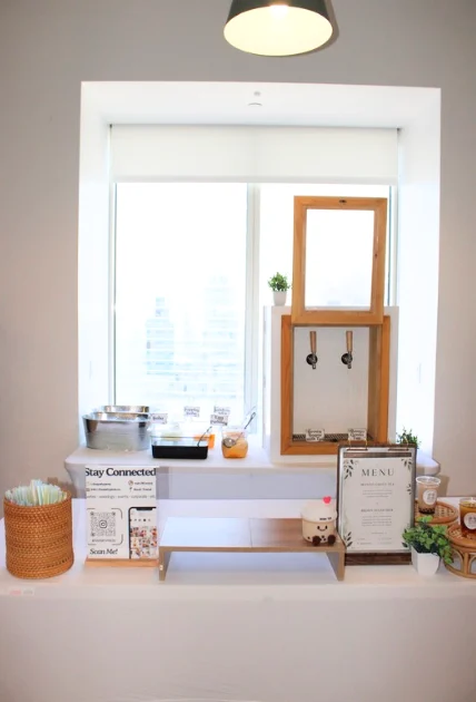 Portable dual tap boba dispenser on a white table