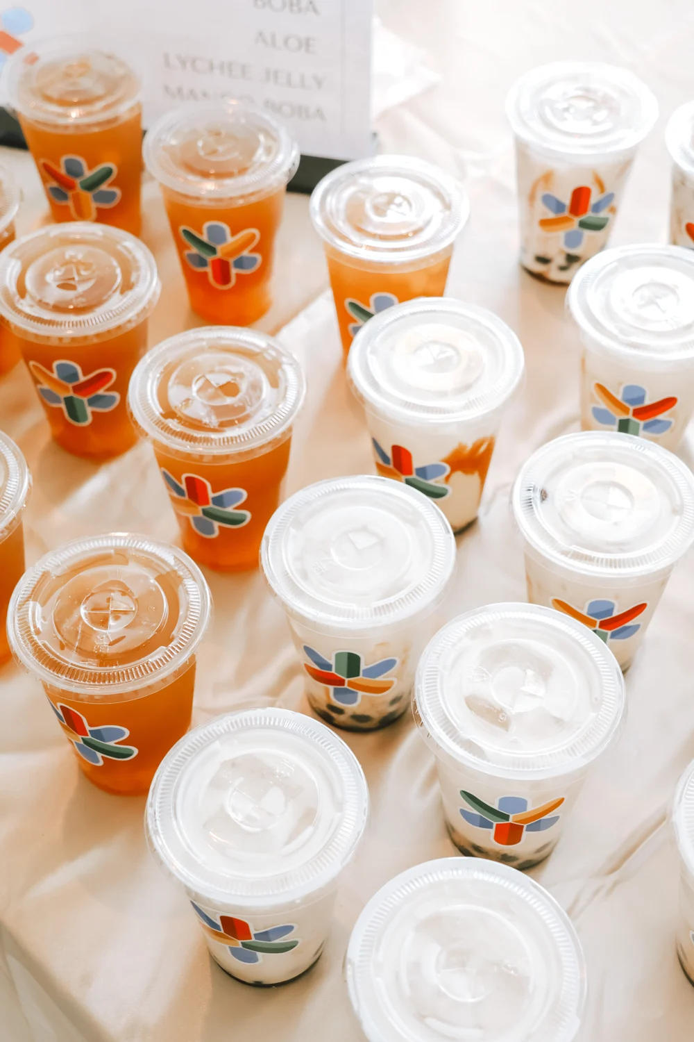 Pre made cup catering with a flower logo