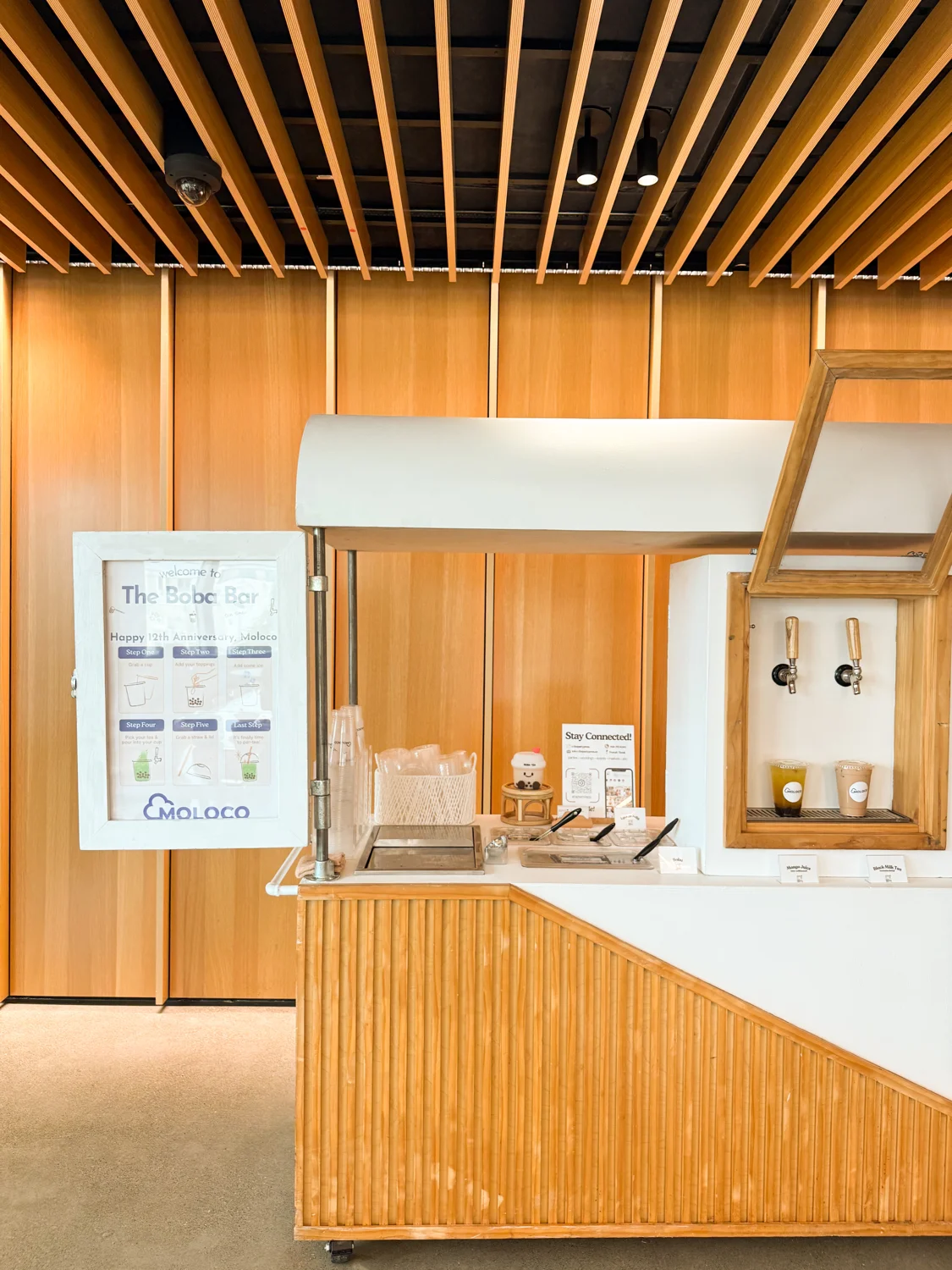 Wooden slat self serve boba cart with dual taps