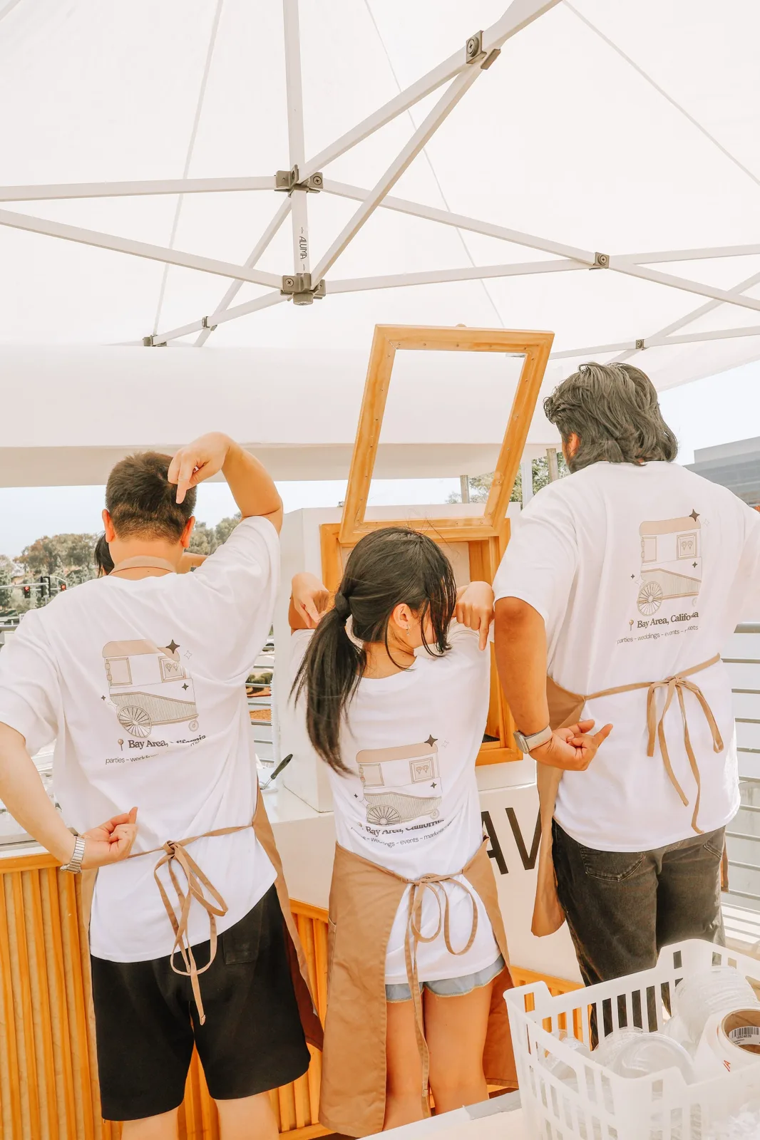 The Party Press team setting up a branded event cart